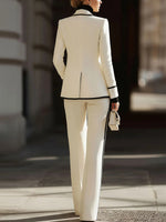 Sleek And Refined Ivory-white Suit Set Featuring Contrasting Piping And Wide-leg Trousers.