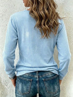 Ribbed Top With An Asymmetric Buttoned Placket