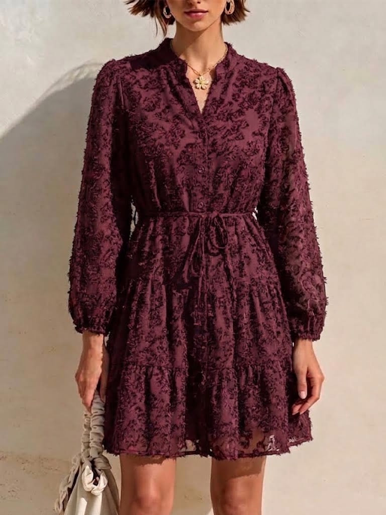 Long-sleeve, Short Dress Featuring A V-neck, Partial Button Placket, Tie-waist, And Ruffled Hem, Crafted From Jacquard Fabric With A Cut-out Floral Design
