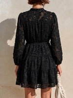 Long-sleeve, Short Dress Featuring A V-neck, Partial Button Placket, Tie-waist, And Ruffled Hem, Crafted From Jacquard Fabric With A Cut-out Floral Design