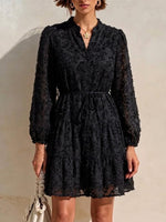 Long-sleeve, Short Dress Featuring A V-neck, Partial Button Placket, Tie-waist, And Ruffled Hem, Crafted From Jacquard Fabric With A Cut-out Floral Design