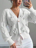 Cozy and casual cable-knit cardigan with 3D bow detail