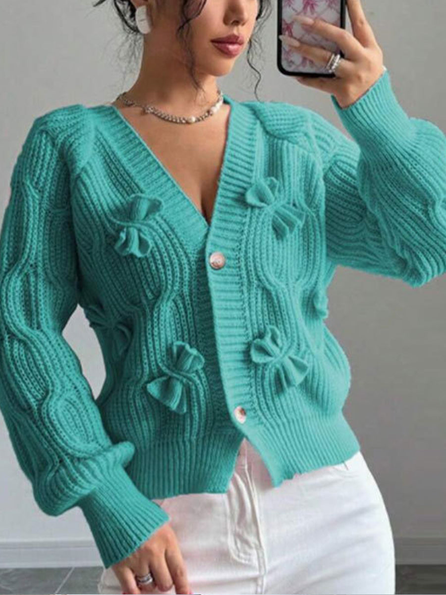 Cozy and casual cable-knit cardigan with 3D bow detail