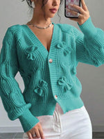 Cozy and casual cable-knit cardigan with 3D bow detail