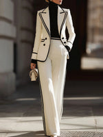 Sleek And Refined Ivory-white Suit Set Featuring Contrasting Piping And Wide-leg Trousers.