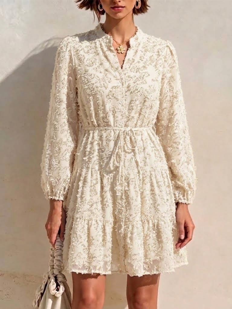 Long-sleeve, Short Dress Featuring A V-neck, Partial Button Placket, Tie-waist, And Ruffled Hem, Crafted From Jacquard Fabric With A Cut-out Floral Design